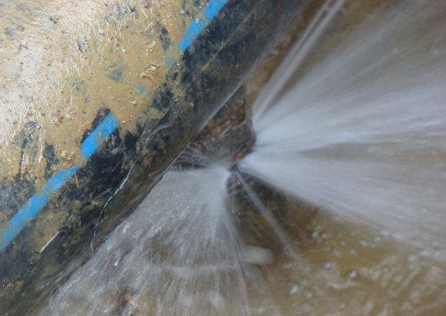 What should I do if a water pipe leaks?